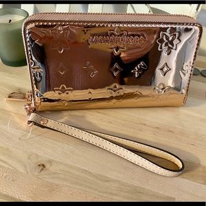 Michael Kors rose gold wristlet. Jet set travel.